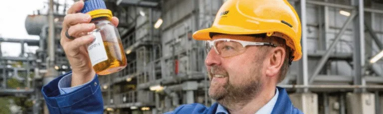 Chemical Recycling ChemCyclingTM From plastic waste to virgin-grade products by BASF - Dr Andreas Kicherer, Sustainability Strategy, with a bottle of pyrolysis oil recovered from plastic waste