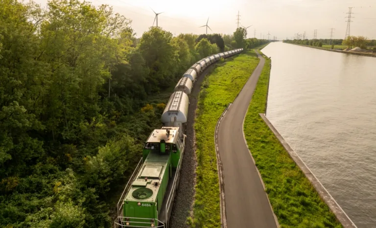 wagon on rail next to water